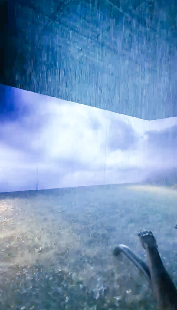 Indoor relaxation room at QC Termemilano featuring ambient lighting and a screen display