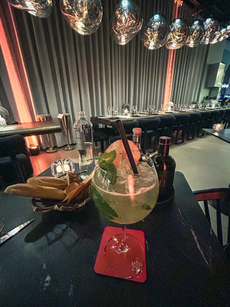 Elegant mocktail served inside The Manzoni restaurant in Milan with sculptural interior design